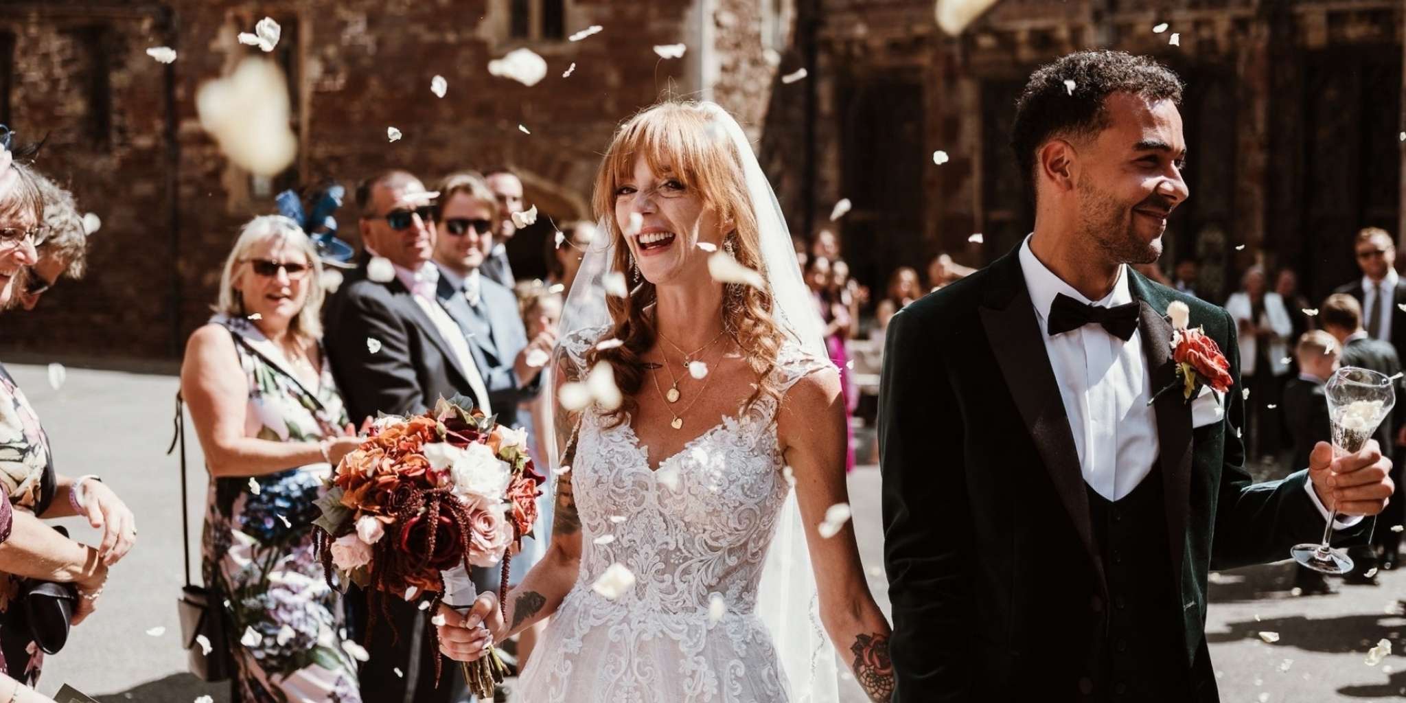 Bride celebrating with biodegradable petal confetti toss.